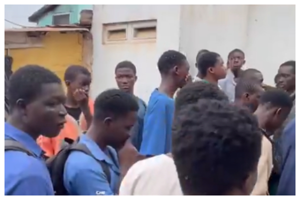 Some students of Kinbu Senior High School at the family house of their deceased colleague