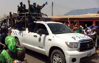 Hon. Abdullah Abubakar at the back of a Police vehicle