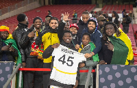 Black Stars defender, Derrick Kohn taking a picture with fans after the Germany game
