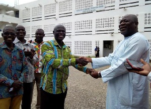 Upper West Regional Minister, Alhaji Sulemana Alhassan (R) handing over keys to the vehicles in Wa
