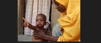 Rashida Musa, 29, tends to her sick child who was sent home from the hospital with malnutrition