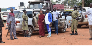 Ms Susan Namuganza (in maroon dress) at Kamuli Central Police Station on Tues. following her arrest
