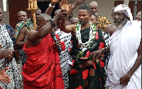 The newly installed paramount chief surrounded by  his divisional