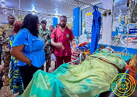 Gender Minister Dr Naa Momo Lartey (in blue blouse) visits victims of Dzorwulu accident