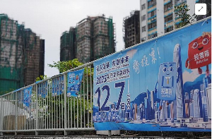 Posters for the upcoming legislative council election near the fire-damaged Wang Fuk Court housing
