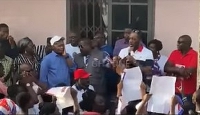NAPO, with the microphone, addressing residents of Kumawu