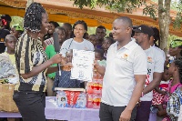 Wisdom Dordoe being honored by the leadership of the Royal Seed Orphanage after the event