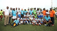 Players and management of Azam in a memorable picture after winning the Mapinduzi Cup