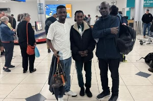 Peter Bawuah (wearing white) and his parents