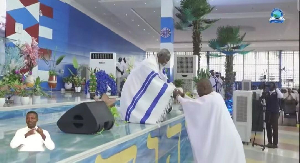 Adom Kyei Duah (L) praying for Sports Minister Kofi Adams (R) Adom Kyei Duah (L) praying for Sports Minister Kofi Adams (R)