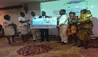 Some staff of Volta Serene presenting the cheque to the workers of the hospital
