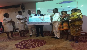 Some staff of Volta Serene presenting the cheque to the workers of the hospital