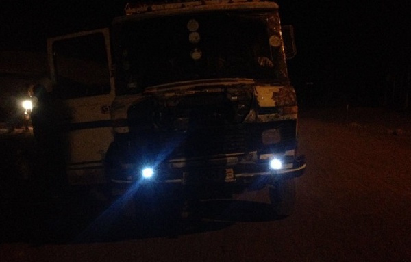 A driver using  torchlight as headlight for his truck