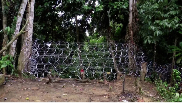 Barbed wire blocks a passage at the Panama-Colombia border, as seen from Bogota, Colombia, on July 5