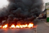 Demonstrators burn tyres in Kumasi to protest Menzgold