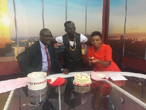 Okyeame Kwame (middle) with hosts of Tv3's New Day