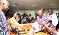 President Akufo-Addo in a handshake with the sacked EC boss