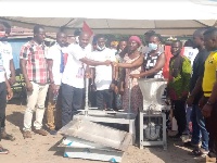Dr. Patrick Boakye Yiadom handing over the equipment to the beneficiaries