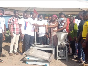 Dr. Patrick Boakye Yiadom handing over the equipment to the beneficiaries