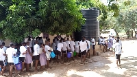 Some students in queue to fetch water