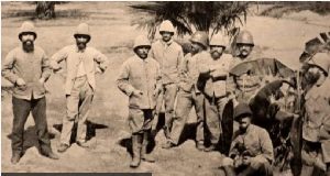 Cameroon's President Paul Biya (R) welcomes Emmanuel Macron at the presidential palace in Yaounde