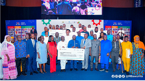 Kosi Yankey-Ayeh (in red) in a group picture with Dr.Mahamudu Bawumia and some dignitaries