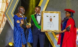 Executive Chairman of Ghana Link Network Services, Dr. Nick Danso Adjei receiving the award