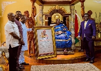 Otumfuor Osei Tutu II with the board and management of Ghana Post