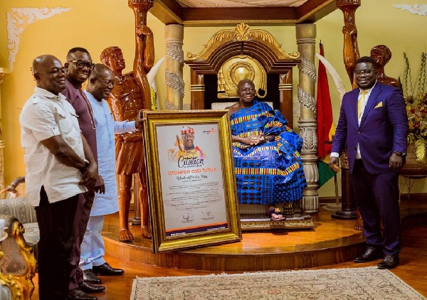Otumfuor Osei Tutu II with the board and management of Ghana Post
