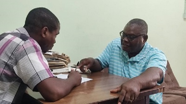 Mr Ashley (right) explaining a point to Ghanaian Times reporter