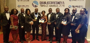 A group photograph of Opportunity International Savings and Loans managemnt team