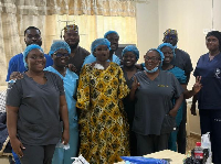 A team of renal health experts with the first patient