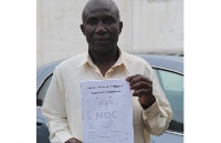 George Boateng displaying the presidential nomination forms