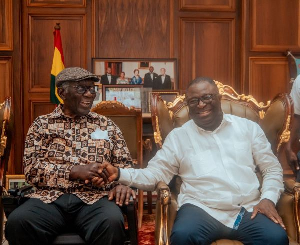 Eugene Boakye Antwi (L) exchanged pleasantries with former President Kufuor (R)