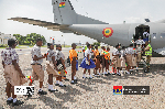 Some of the school children boarding an aircraft at the Airforce Base in Accra