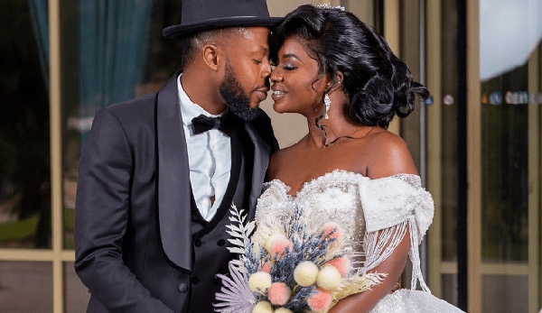 Kalybos (L) and Ahuofe Patri (R) posing for a make-believe wedding