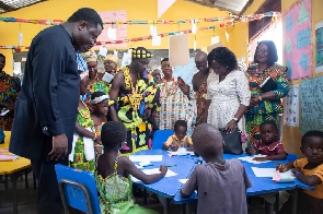 Rev Ntim Fordjour interacting with some children
