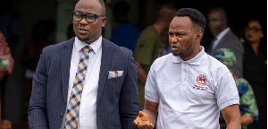 Adeniyi Mobolaji Kayode, right, leaves court with his lawyer on Thursday