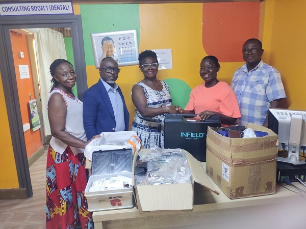 Members of UGAG presenting the items to officials of the Mary Lucy Hospital