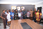 Sharon Dede Padi gifts leaf-print artwork to Dzifa Gomashie