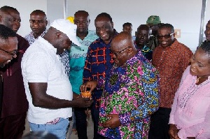 President Akufo-Addo tasting some products from the factory