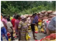 Snipped of residents of Adugyama looting rice from an overturned truck