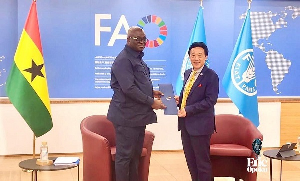 Minister for Food and Agriculture Eric Opoku (L) with FAO Director-General Dr QU Dongyu