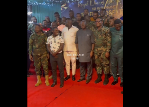 Otumfuo Osei Tutu II with his security officials during a royal dinner