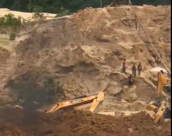 Some of the illegal miners who escaped death when a mudslide struck