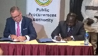 Andre Coetzee, representative of Cormmerce Edge (L) and CEO of PPA, AB Adjei (R) signing the MoU