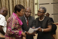 Justice Victor Ofoe (m) interacting with the Chief Justice Sophia Akuffo (l), and Justice Gifty Deky