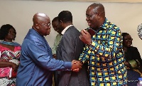President Akufo-Addo in a handshake with Dr. Anthony Yaw Baah, TUC Secretary General