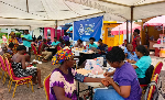 People are seen going through health screening
