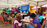People are seen going through health screening